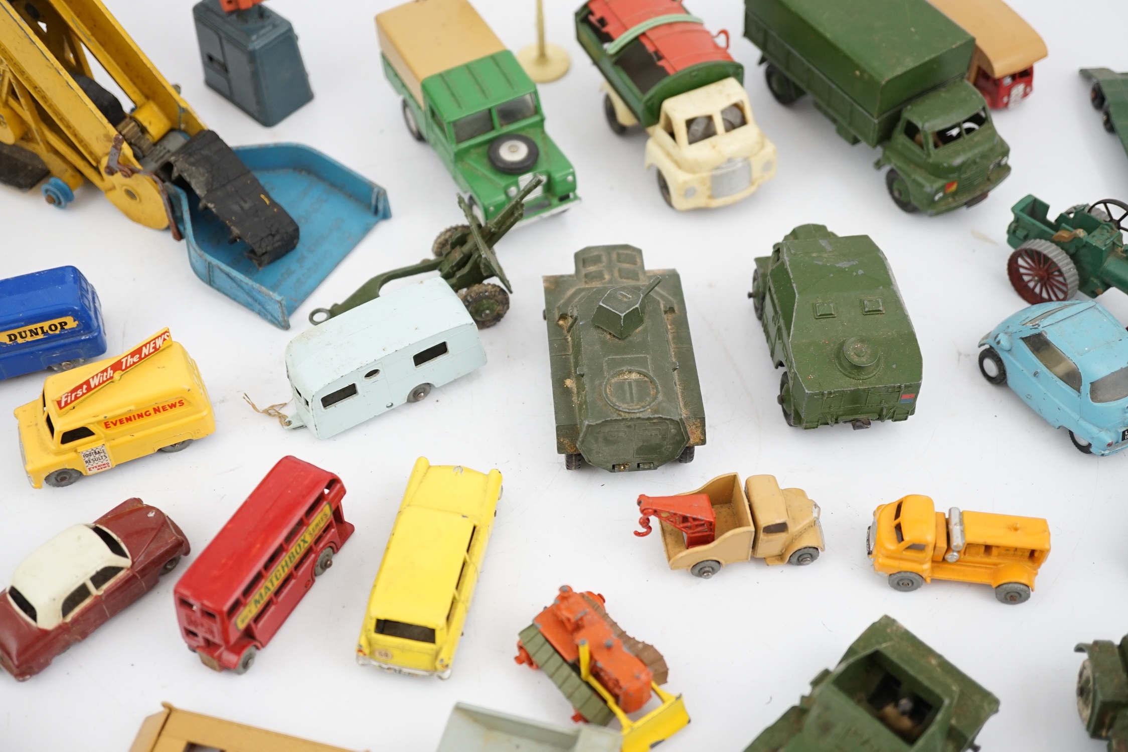 Thirty-eight diecast vehicles by Dinky Toys, Corgi Toys, Matchbox, etc. including a Spot-On BMW Isetta, military Dinky vehicles, Matchbox Series, etc.